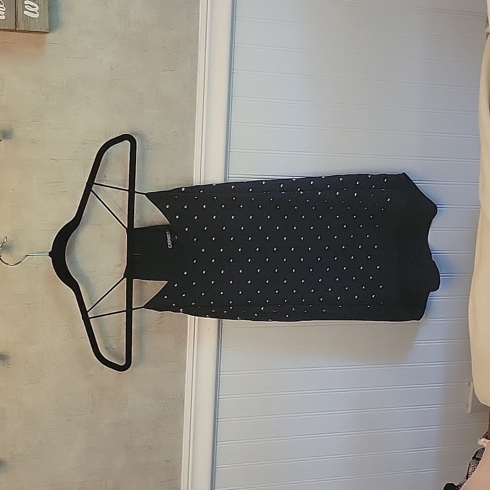 Black strappy tank top with metal studs, none missing